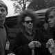 Andy Bell (left) and Mark Gardener (right) of Ride talk to Robert Smith of the Cure (center) backstage at Crystal Palace Bowl before a concert by The Pixies, London, United Kingdom, 8th June 1991. (Photo: Martyn Goodacre/Getty Images)"